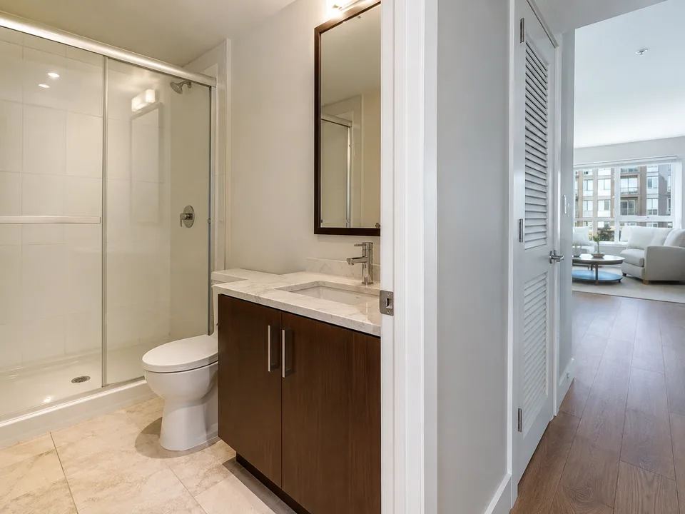 Residential cleaner detailing a Bellevue bathroom mirror and vanity